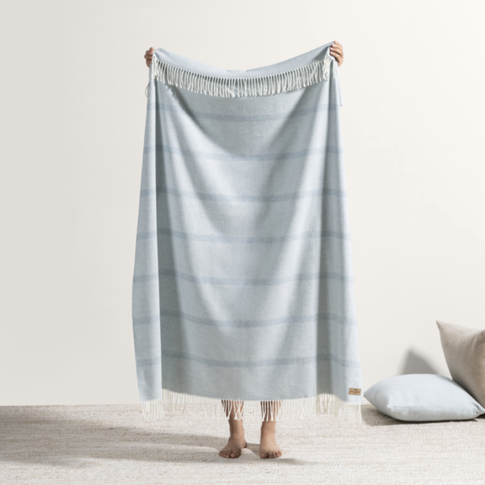 soft blue striped throw with fringe
