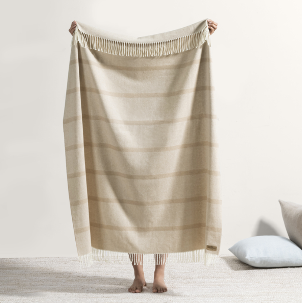 soft sand-color striped throw with fringe