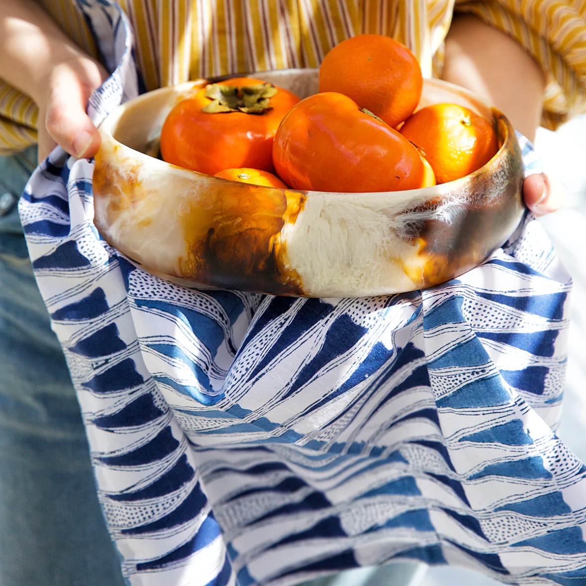 bowl of persimmons with block print napkin