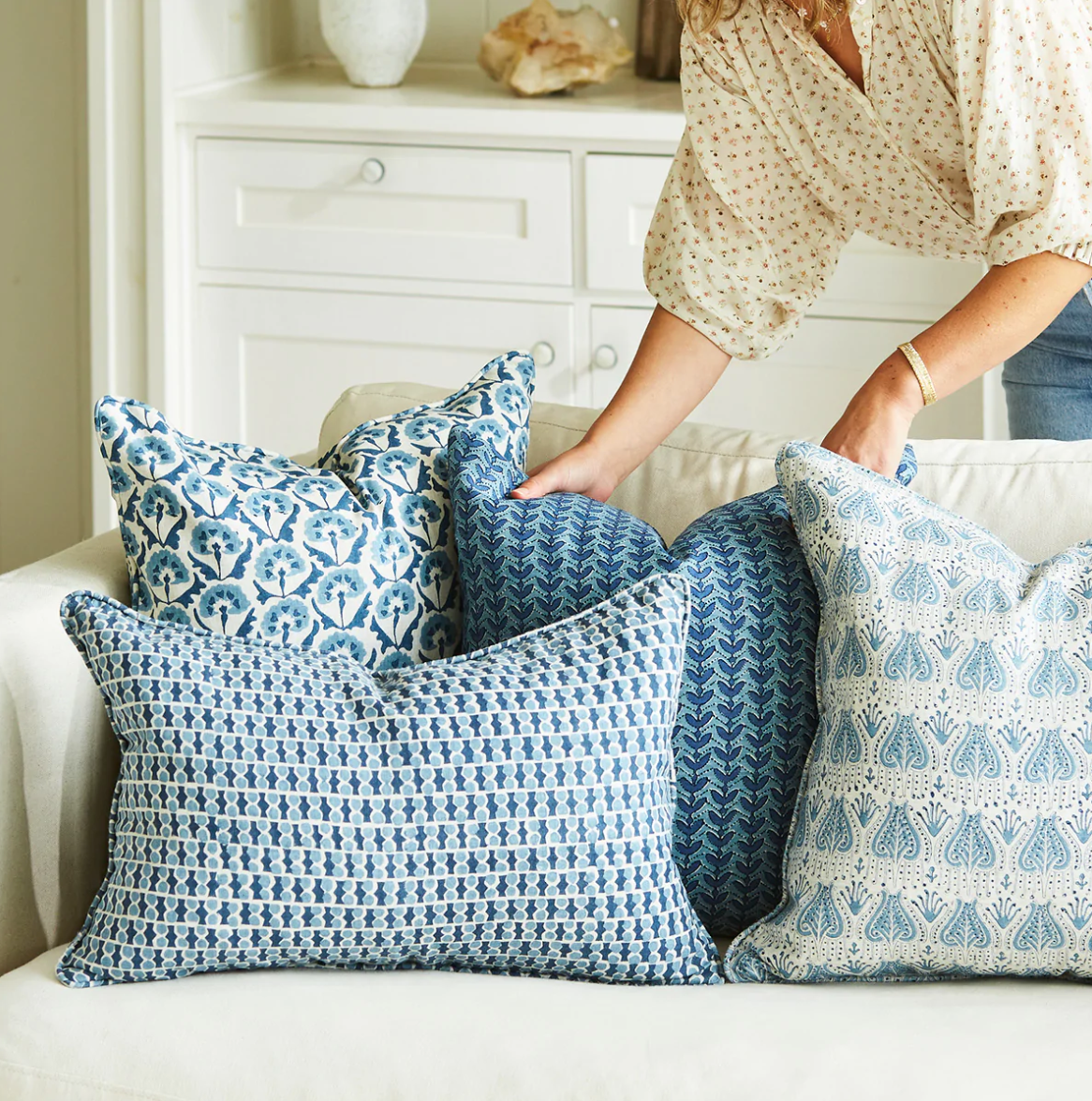 grouping of blue pillows in a sofa