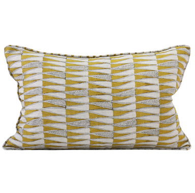 saffron colored pillow with block print design