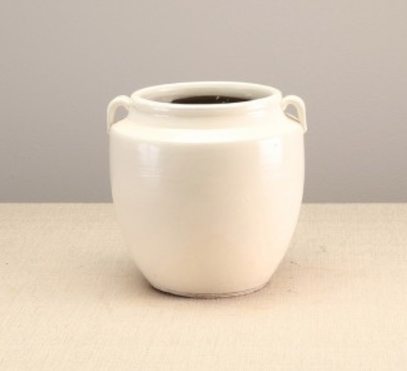 creamy white pottery jar with handles