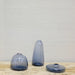 collection of three transparent blue glass vases