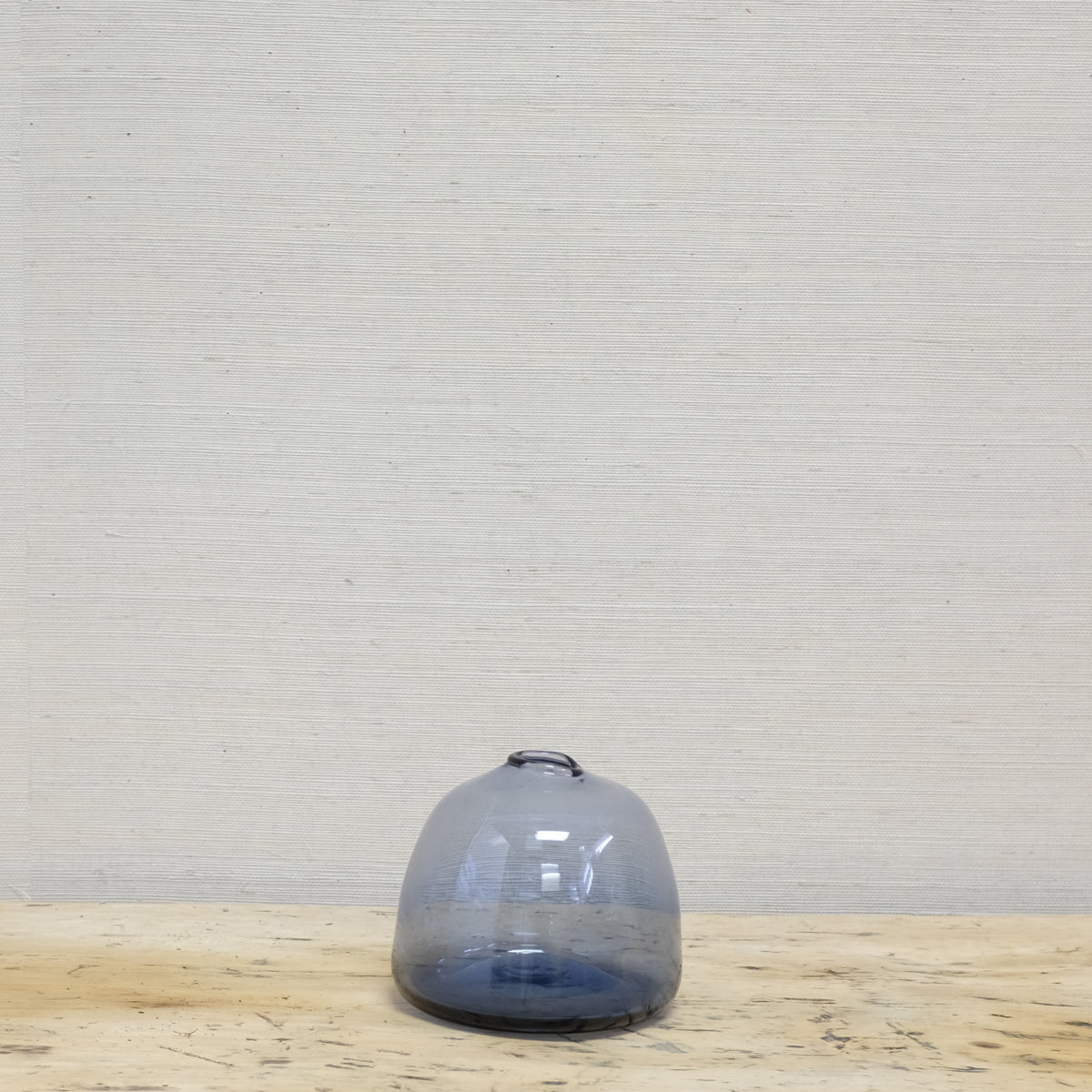 nearly round blue glass vase