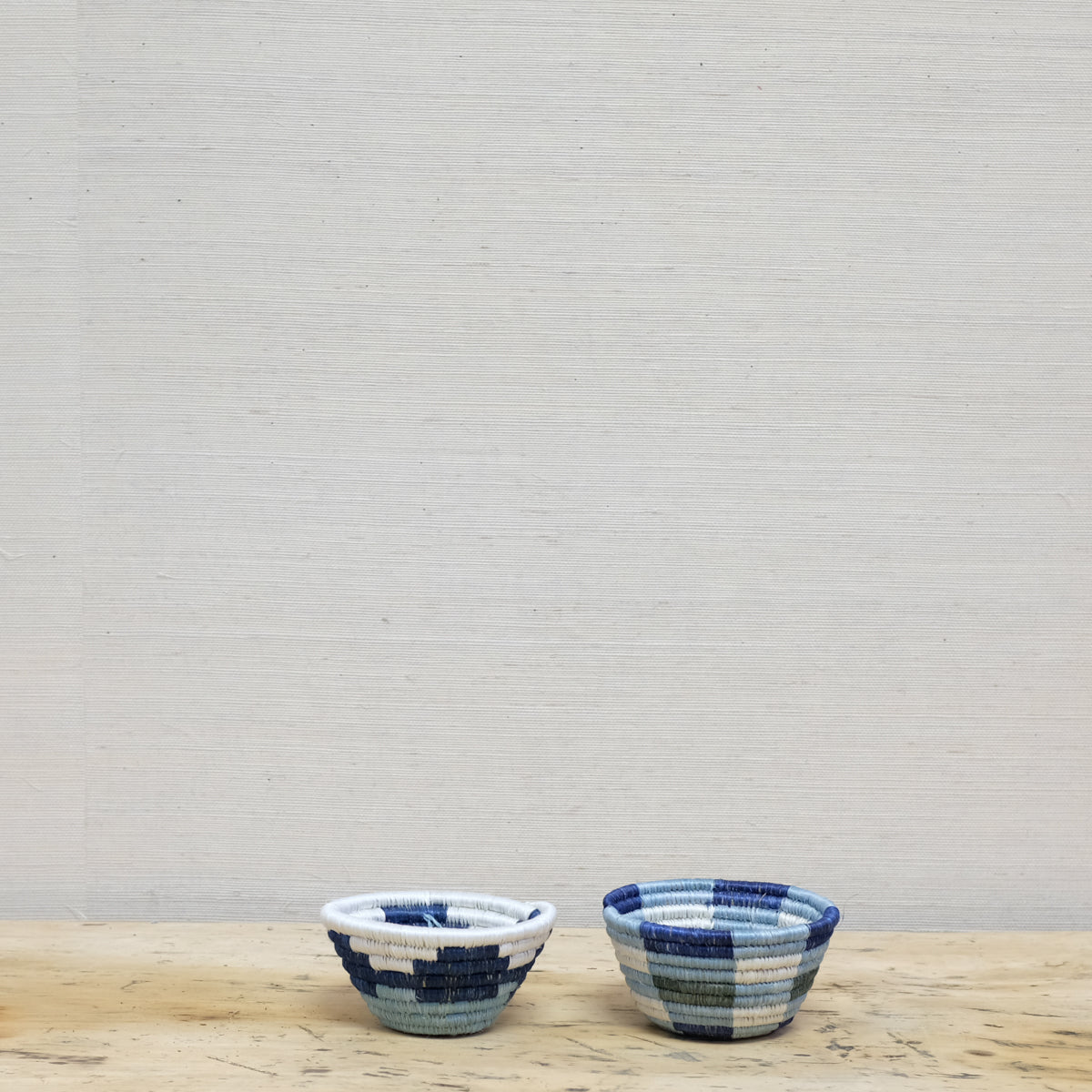 two blue and white small baskets