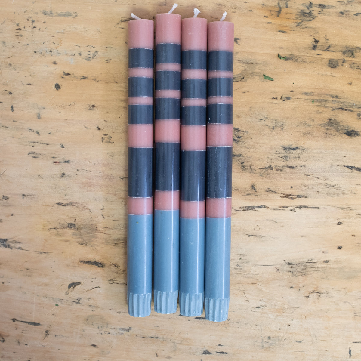 blue and pink striped candles