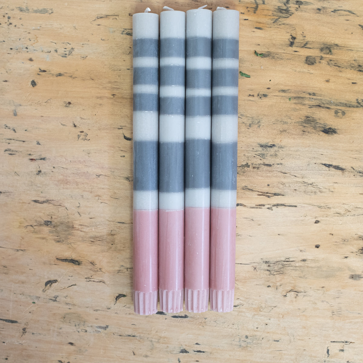blue, gray and pink striped candles