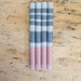 blue, gray and pink striped candles
