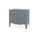 three-drawers chest of drawers covered in blue grasscloth and edged in brass