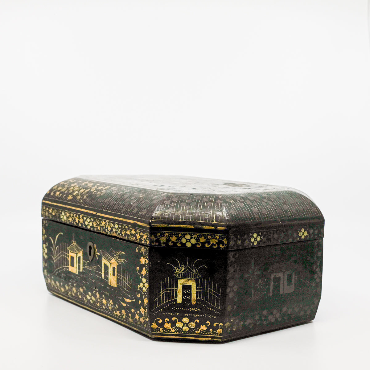 corner view of black and gold paper marche lidded box