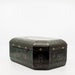back corner view of black and gold paper marche lidded box