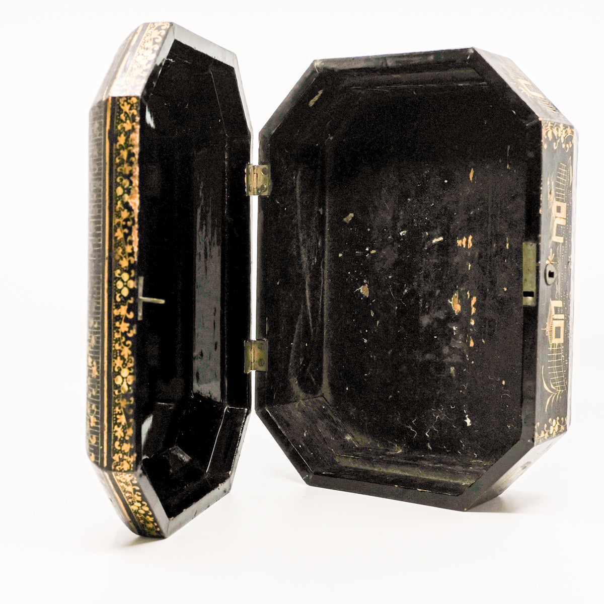 inside of black and gold antique box