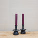 merlot color candles in black candleholders