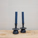 blue slate candles in black pottery candleholders