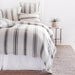 striped linen duvet cover and shams on bed