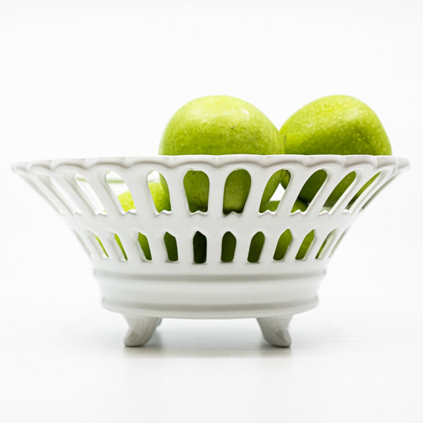 white china basket with green apples