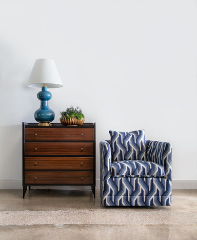 vintage Italian chest of drawers with patterned swivel chair