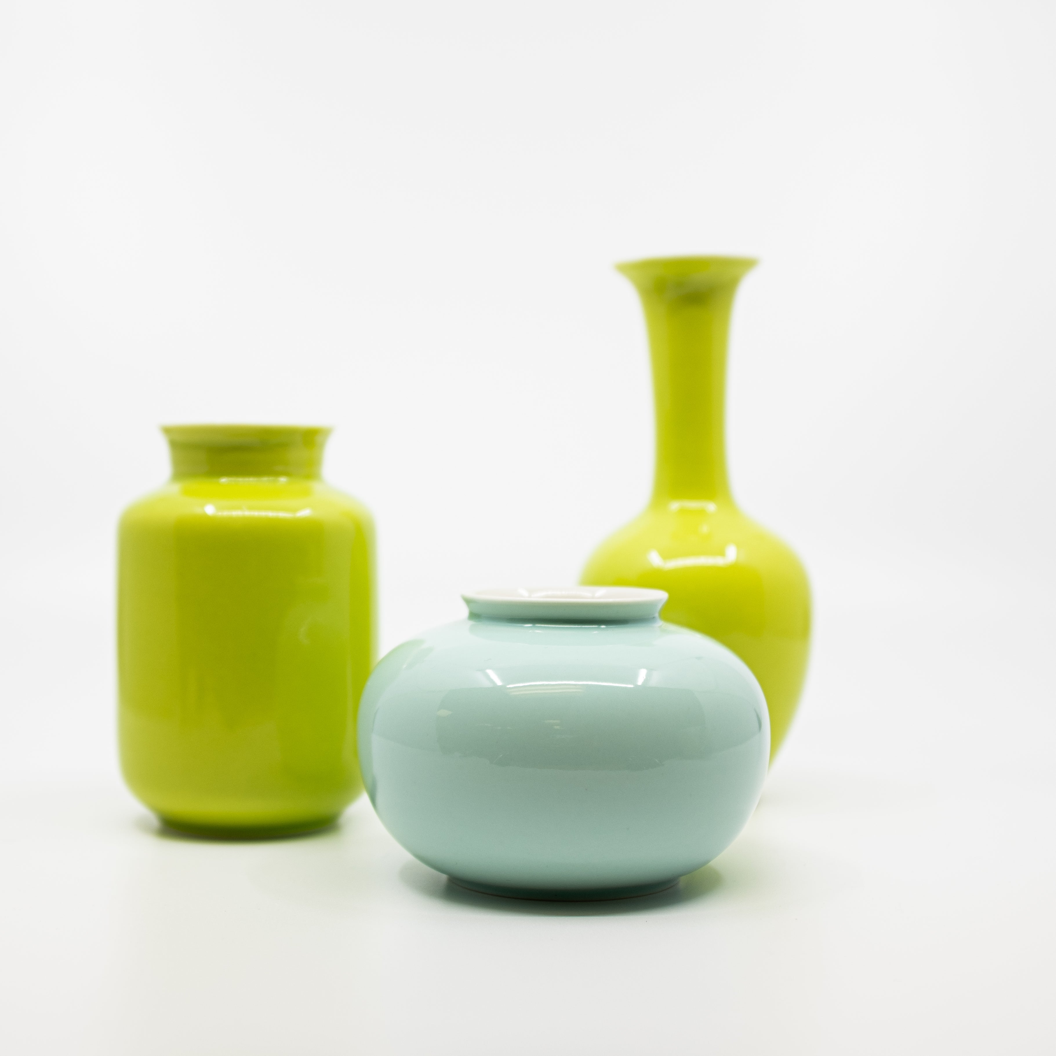 glossy green and celadon bud vases