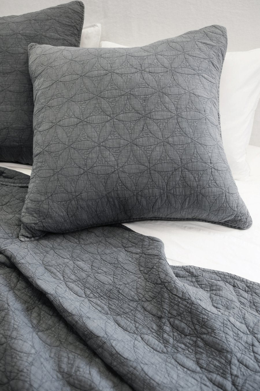 quilted coverlet and shams in gray
