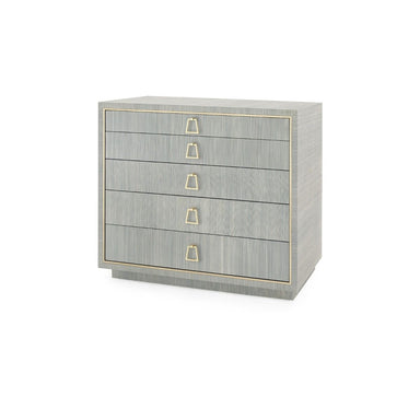 five-drawer blue chest in blue grasscloth with brass pulls