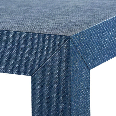 corner detail of blue grasscloth cocktail table