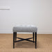 black legged upholstered stool