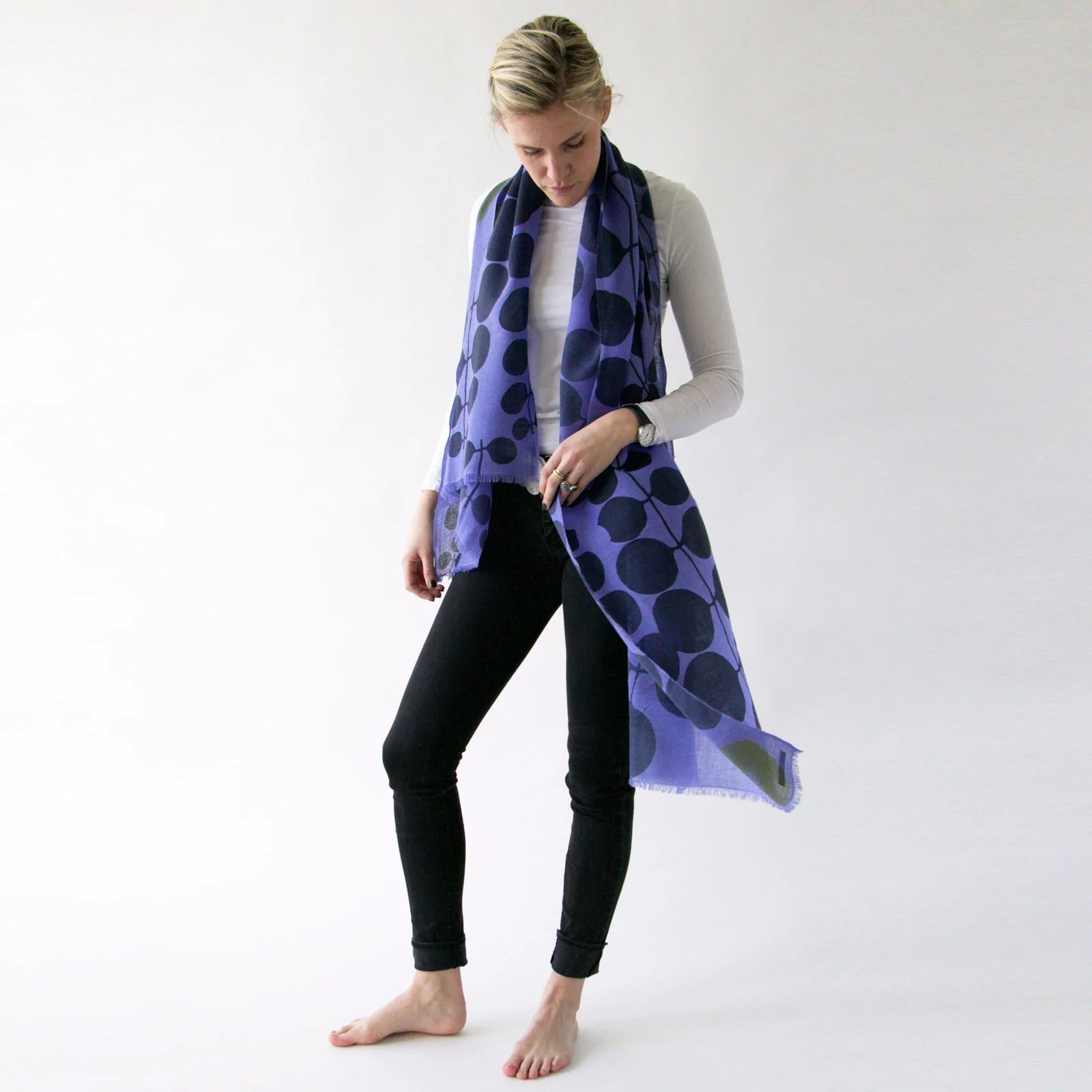 woman modeling purple and dark blue merino scarf